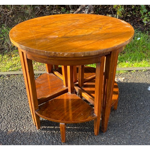 588 - Walnut circle nest of 4 tables, damage to edge of veneer measures approx 19 inches tall 23 inches di... 