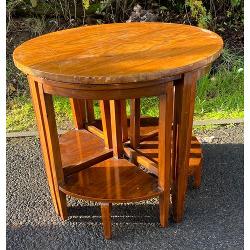 588 - Walnut circle nest of 4 tables, damage to edge of veneer measures approx 19 inches tall 23 inches di... 