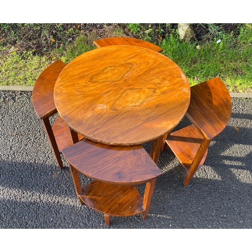 588 - Walnut circle nest of 4 tables, damage to edge of veneer measures approx 19 inches tall 23 inches di... 