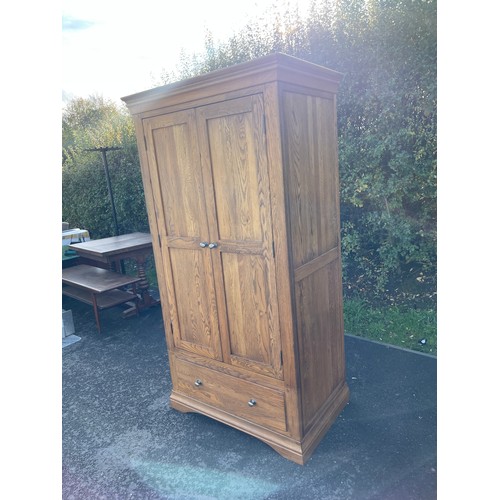 618 - 2 door 1 drawer oak wardrobe measures approx 75 inches tall 39 inches wide 25.5 inches deep