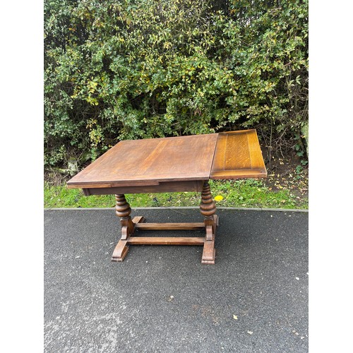 625 - Oak extending drawer leaf dining table measures approx 13.5inches tall 36 inches wide (open 60 inche... 