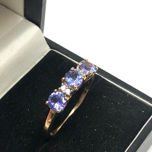 119 - 9ct gold Tanzanite & diamond ring weight 2.7g