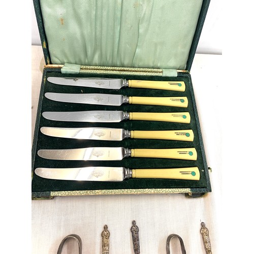 83 - Selection of silver plated cutlery includes art deco knife set