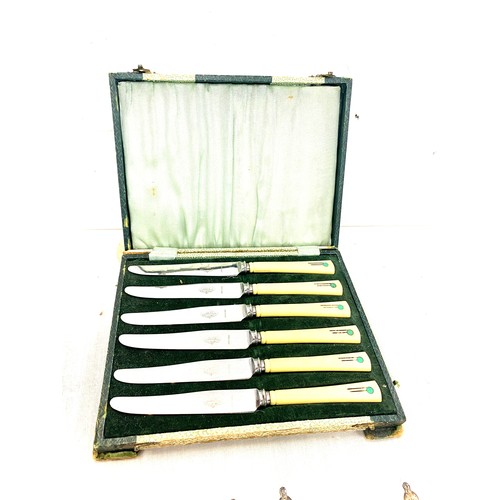 83 - Selection of silver plated cutlery includes art deco knife set