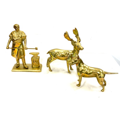 32 - 3 Heavy brass figures includes a Deer, Dog and a Black smith tallest measures 8 inches