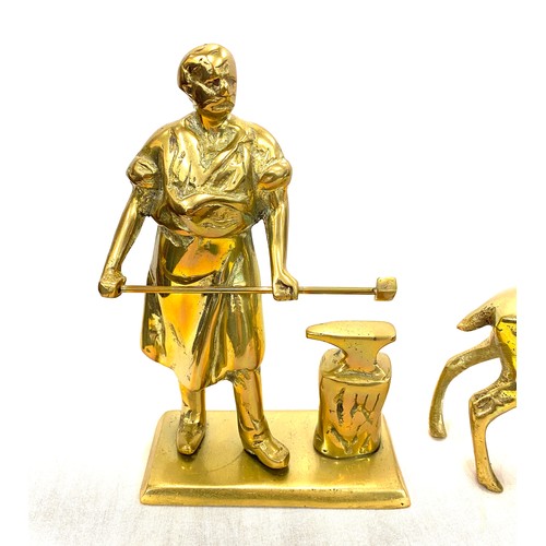 32 - 3 Heavy brass figures includes a Deer, Dog and a Black smith tallest measures 8 inches