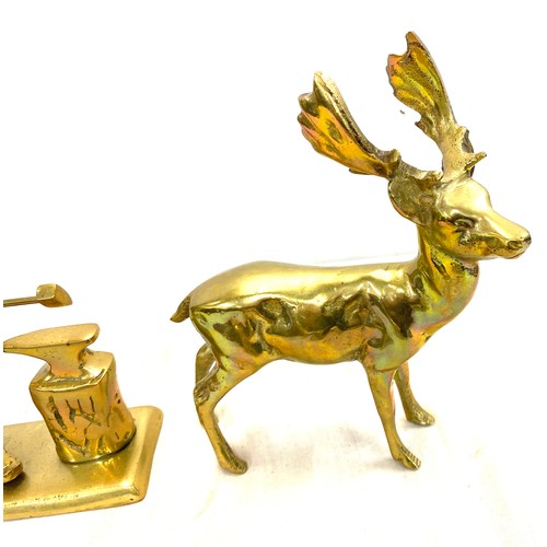 32 - 3 Heavy brass figures includes a Deer, Dog and a Black smith tallest measures 8 inches