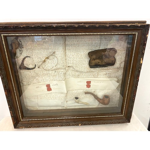 234 - Cased diorama includes spectacles and smoking pipes, case measures approx 16 inches by 21 inches