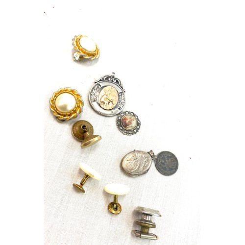 603 - Selection of costume jewellery includes silver fob, silver locket etc