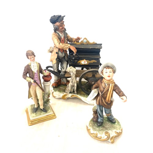 71 - Three Capodimonte figures includes Defendi news boy, the old man w/dog and court young man