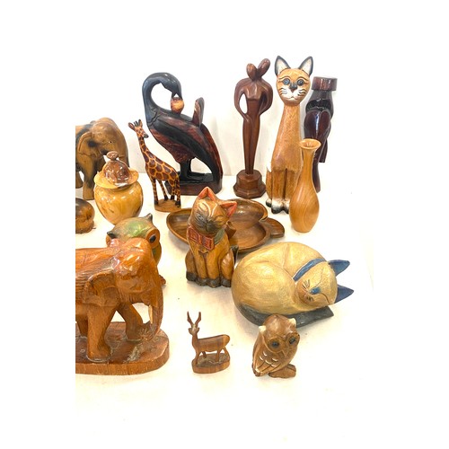 140 - A box containing wooden animal hand carved ornaments