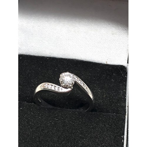 165 - Fine 18ct white gold diamond ring set with central diamond measures approx 4mm with  diamond shoulde... 