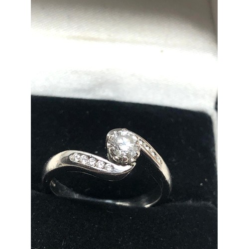 165 - Fine 18ct white gold diamond ring set with central diamond measures approx 4mm with  diamond shoulde... 