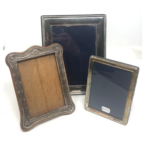 21 - 3 silver picture frames largest measure approx 22cm by 18cm