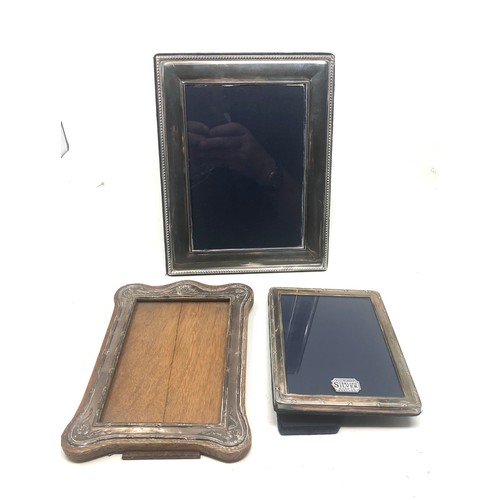 21 - 3 silver picture frames largest measure approx 22cm by 18cm