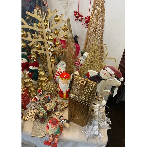 256 - Large selection of assorted Christmas decorations includes Tree figures, snow man decorations etc