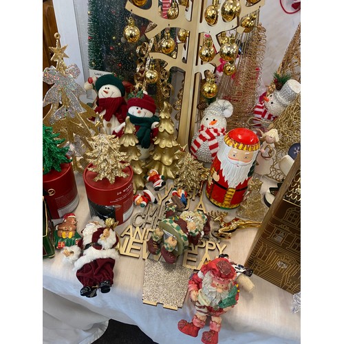 256 - Large selection of assorted Christmas decorations includes Tree figures, snow man decorations etc