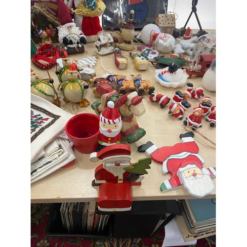 313 - Large selection of assorted Christmas decorations includes musical figures, metal reindeer figure, s... 