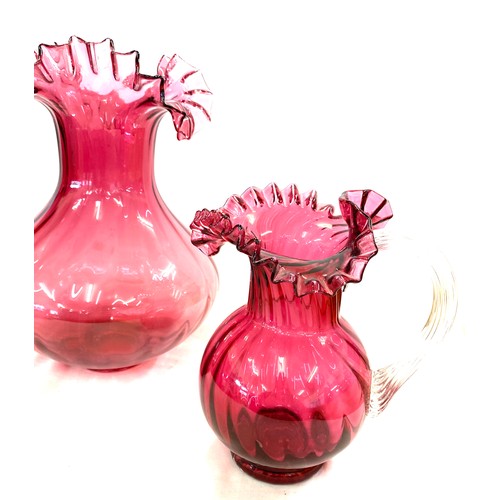 2 - Cranberry glass vase and jug, approximate height of vase: 11.5 inches