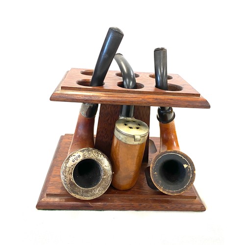 38 - 3 Vintage smoking pipes and stand, one with silver rim