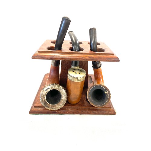 38 - 3 Vintage smoking pipes and stand, one with silver rim