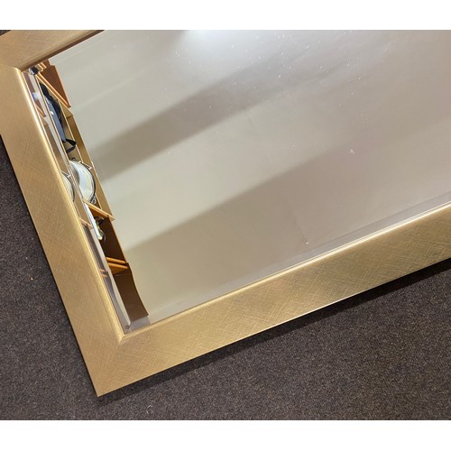 194 - Large gold frame bevel edge wall mirror, approximate measurements 43 by 30.5 inches