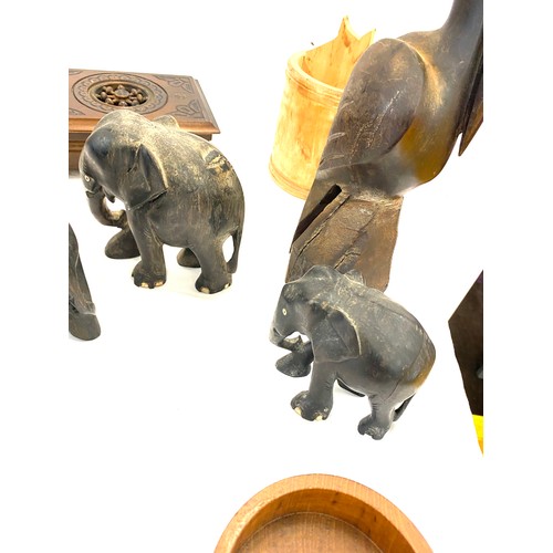 150 - Selection of items to include a carved elephant, stork and other treen