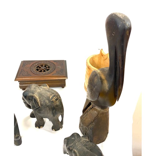 150 - Selection of items to include a carved elephant, stork and other treen