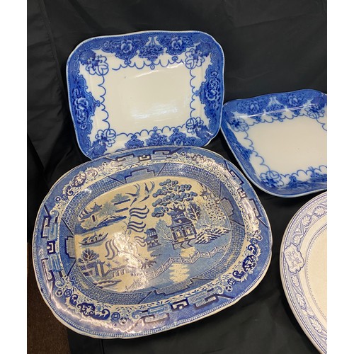 219 - 4 Large antique and later blue and white meat plates to include Indian B & H etc