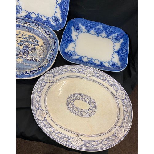 219 - 4 Large antique and later blue and white meat plates to include Indian B & H etc