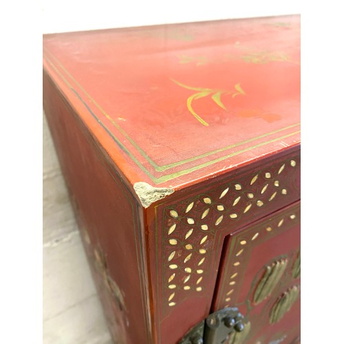 356 - 2 Door red lacquered Chinese inlayed cabinet with 2 internal shelves measures approx 48 inches tall ... 