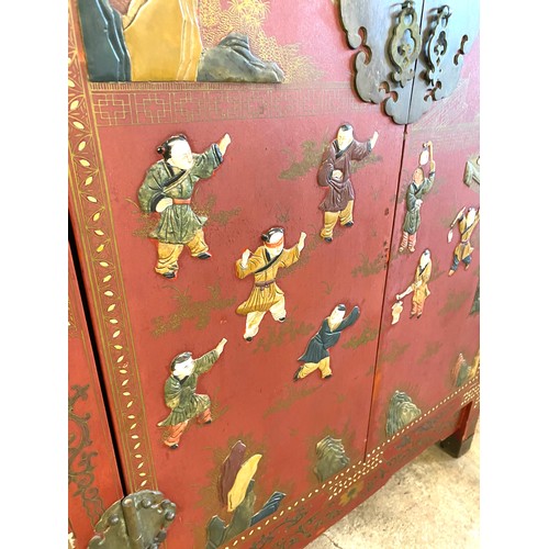 356 - 2 Door red lacquered Chinese inlayed cabinet with 2 internal shelves measures approx 48 inches tall ... 