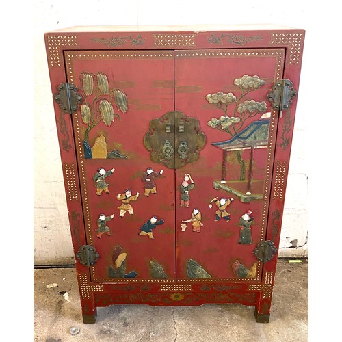 356 - 2 Door red lacquered Chinese inlayed cabinet with 2 internal shelves measures approx 48 inches tall ... 