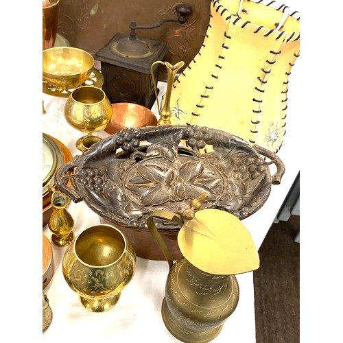 260 - Collection of brass and copper items to include jugs, trays, goblets etc