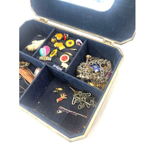 586 - Box of costume jewellery includes silver charm bracelet (some charms not silver), pocket knife, badg... 