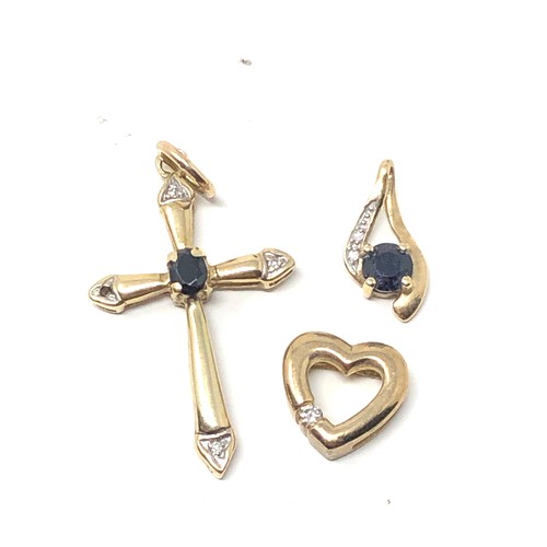 207 - 4 x 9ct gold sapphire & diamond set pendants inc. cross, heart & cluster 4.2g