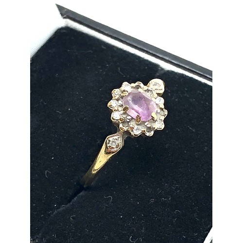 232 - 9ct gold diamond framed amethyst ring (1.8g)