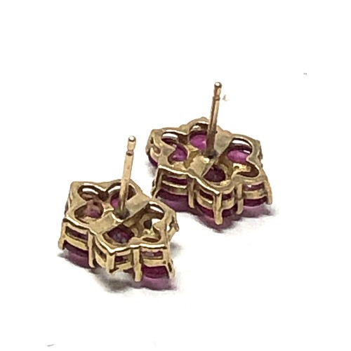 180 - pair 9ct gold ruby earrings missing 2 rubies weight 2g