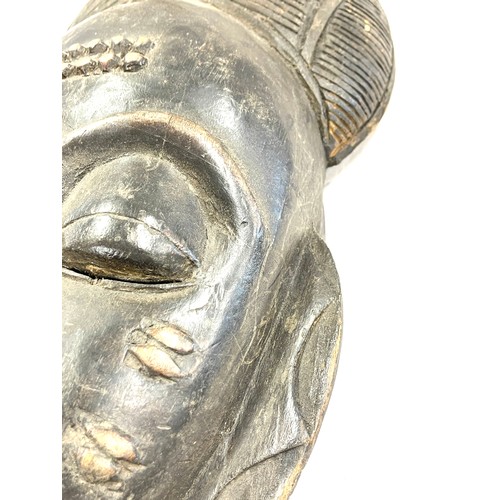 107 - A 19th/early 20th century central/west African ceremonial mask. Good detailing with scarification de... 