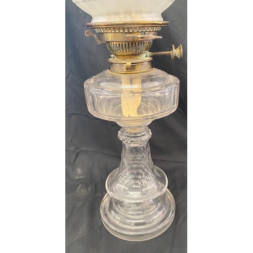 111 - Vintage glass oil lamp, with shade and funnel approximate height: 24 inches, small chip can be seen ... 