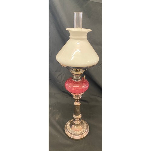 113 - Small silver plated Vintage  cranberry font oil lamp, approximate height 20.5 inches, loose fitting