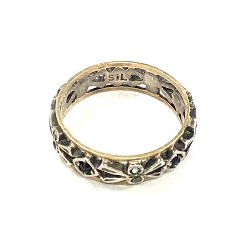 595 - 9ct gold and silver eternity ring set with multi coloured stones, approximate weight 2.1g