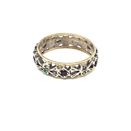 595 - 9ct gold and silver eternity ring set with multi coloured stones, approximate weight 2.1g