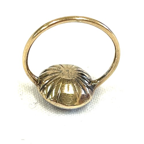 109 - George III foiled paste unmarked gold ring, the paste stone with pink foiled closed back setting, di... 