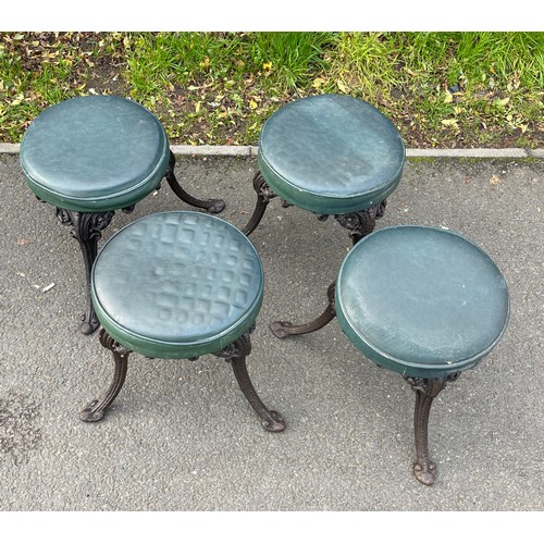 390 - Four vintage cast iron pub stools