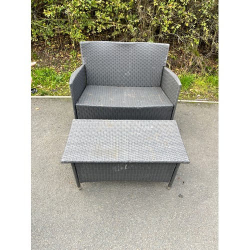 100L - Rattan two seater and a matching rattan table measures approx 33inches tall  43 inches wide 21 inche... 