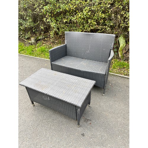 100L - Rattan two seater and a matching rattan table measures approx 33inches tall  43 inches wide 21 inche... 