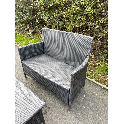 100L - Rattan two seater and a matching rattan table measures approx 33inches tall  43 inches wide 21 inche... 