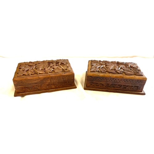 142 - Pair of vintage wooden carved cigarette boxes, each measures approx 3 inches tall 8 inches wide