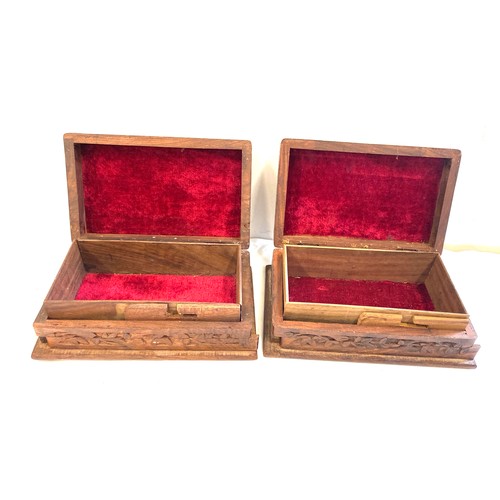 142 - Pair of vintage wooden carved cigarette boxes, each measures approx 3 inches tall 8 inches wide